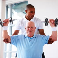 caregiver assisting patient in lifting weights