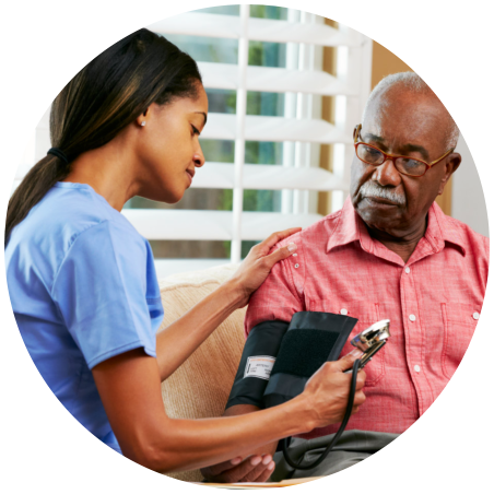 caregiver taking blood pressure of patient